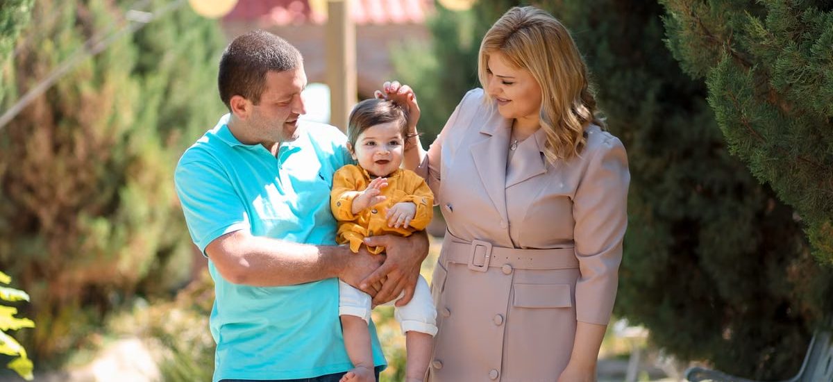 Family enjoying a sunny day outdoors, showcasing love and connection.