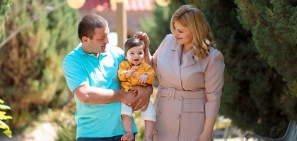Family enjoying a sunny day outdoors, showcasing love and connection.