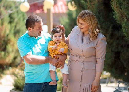 Family enjoying a sunny day outdoors, showcasing love and connection.